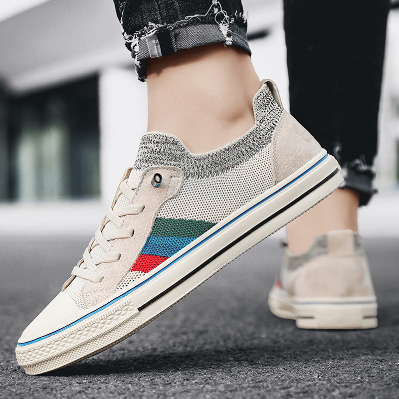 Ladies' sneakers with breathable mesh structure and trendy striped elements