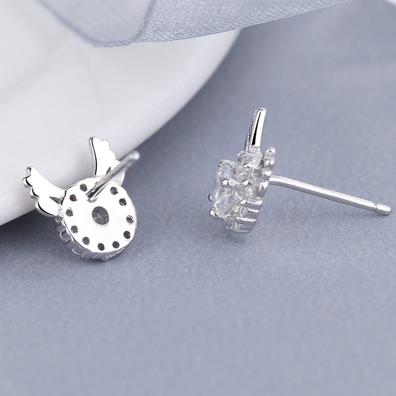 Women's earrings with sparkling crystals and playfully designed wings Tom Cottons