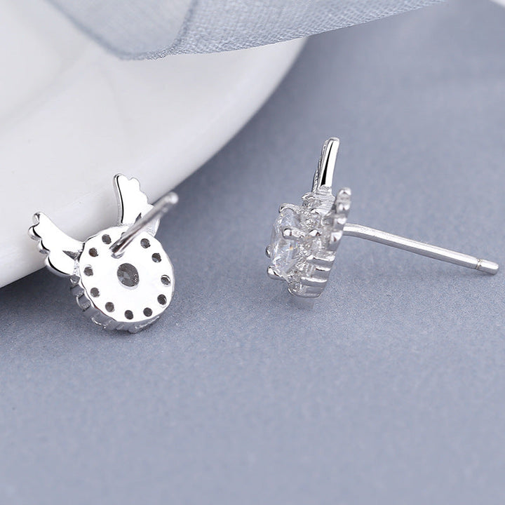 Women's earrings with sparkling crystals and playfully designed wings Tom Cottons