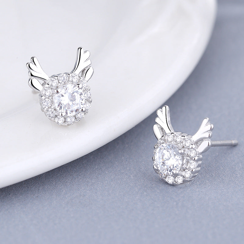 Women's earrings with sparkling crystals and playfully designed wings Tom Cottons