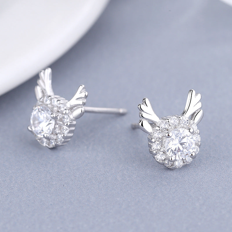 Women's earrings with sparkling crystals and playfully designed wings Tom Cottons
