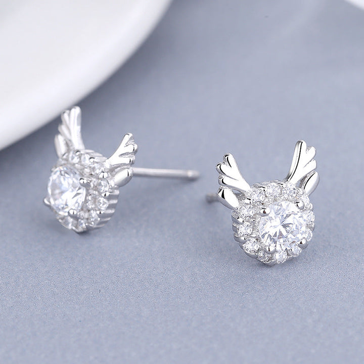 Women's earrings with sparkling crystals and playfully designed wings Tom Cottons