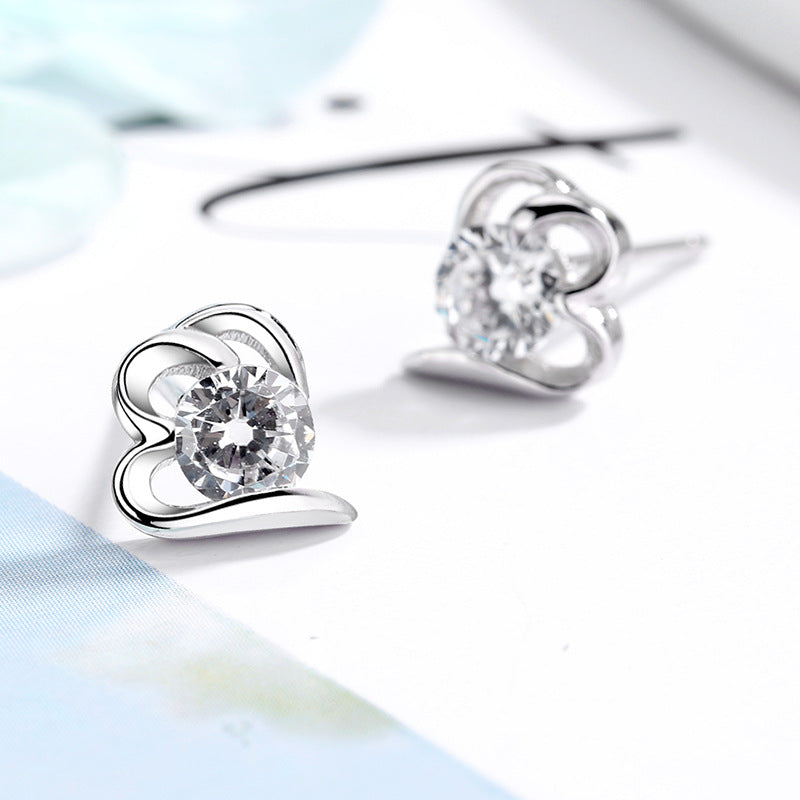 Women’s stud earrings with stylish heart design and sparkling crystals Tom Cottons