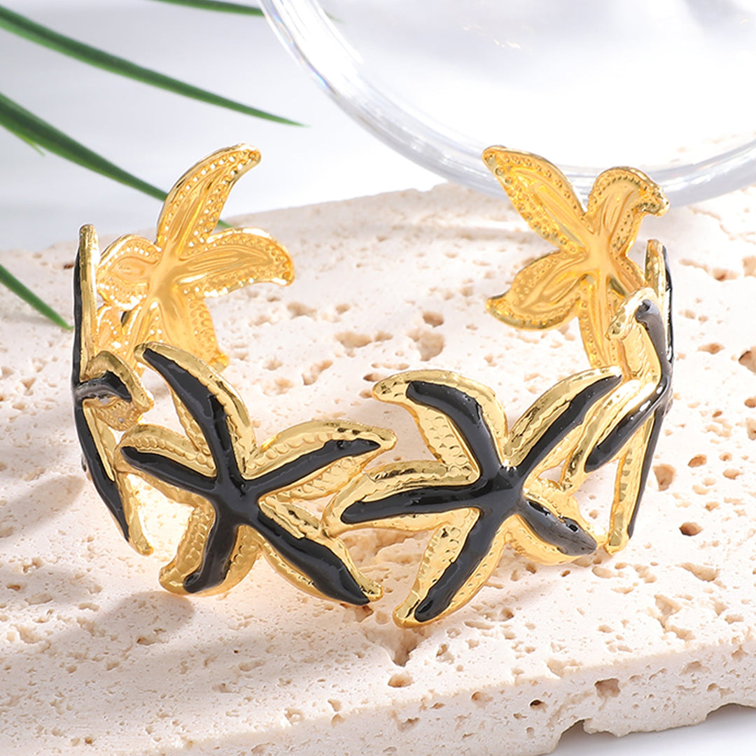 Ladies Open Cuff Bracelet with Expressive Star Motif Tom Cottons