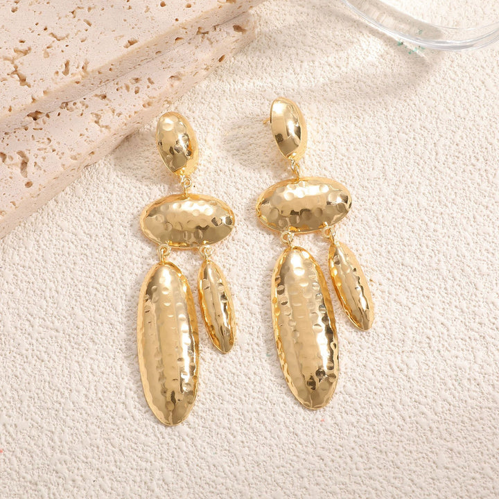 Women Hanging Earrings with artistic, three-dimensional design Tom Cottons