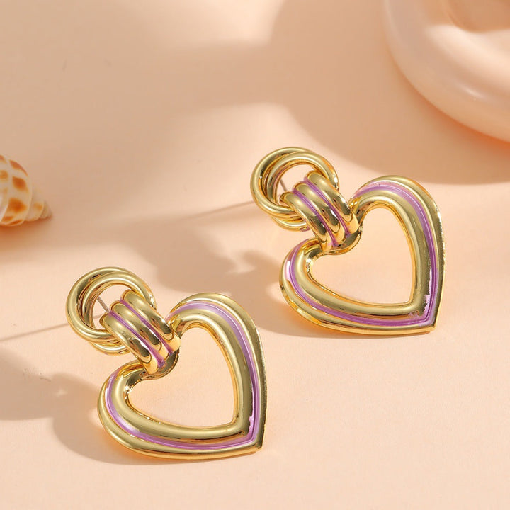 Women’s earrings in modern heart design Tom Cottons