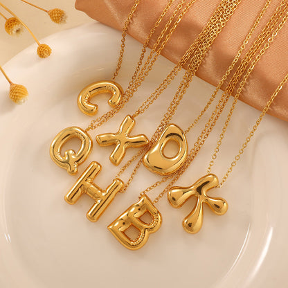 Women's necklace with curved letter pendant Tom Cottons