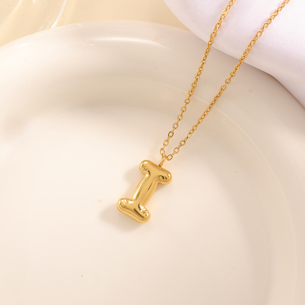 Women's necklace with curved letter pendant Tom Cottons