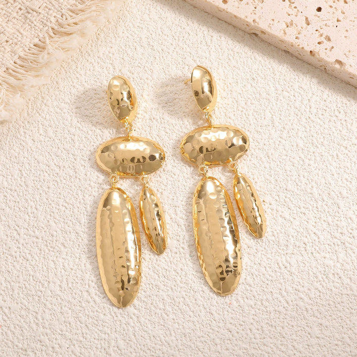 Women Hanging Earrings with artistic, three-dimensional design Tom Cottons
