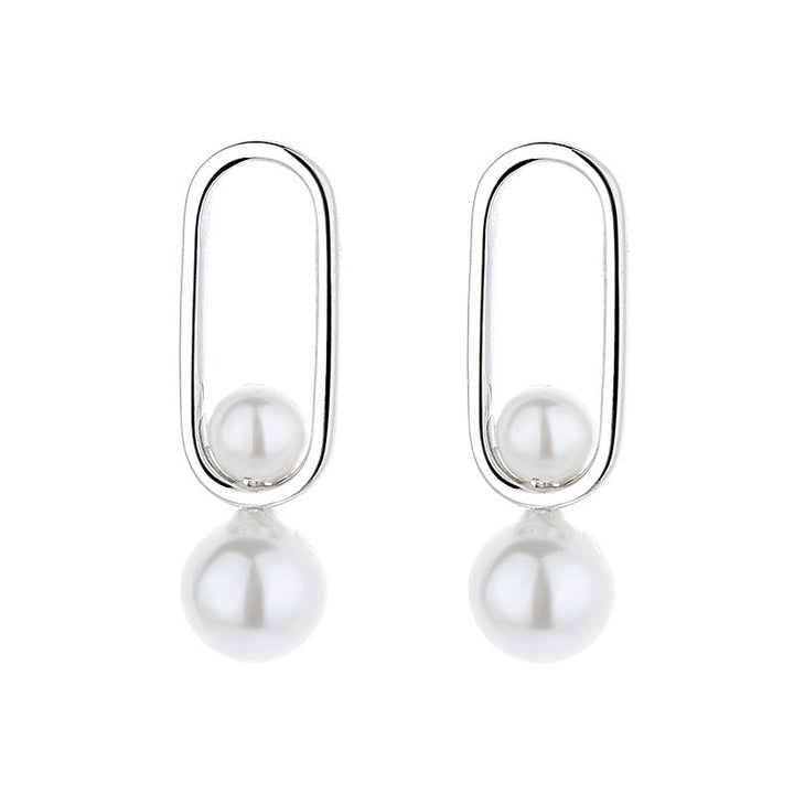 Women's stud earrings with modern oval design and elegant pearls Tom Cottons