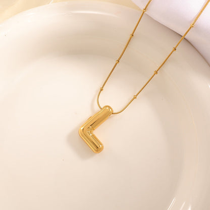 Women's necklace with curved letter pendant Tom Cottons