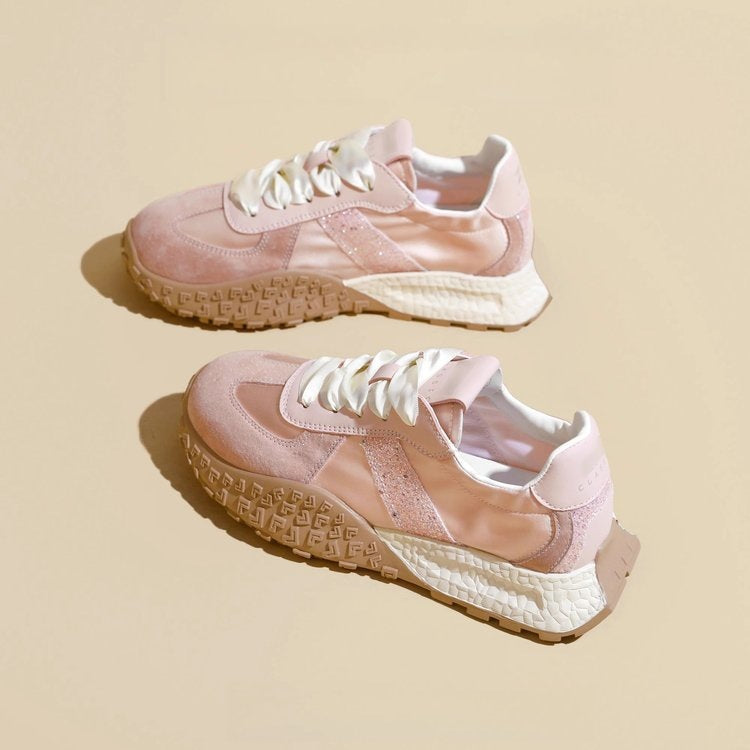 Women's sporty sneakers with sparkling accents and futuristic design
