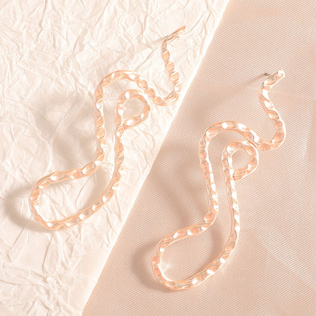 Ladies earrings in elegant wave pattern Tom Cottons