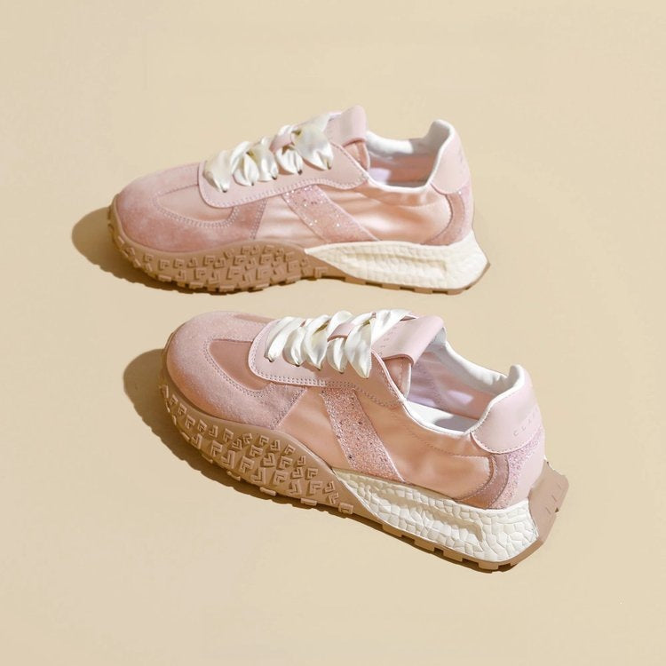 Women's sporty sneakers with sparkling accents and futuristic design