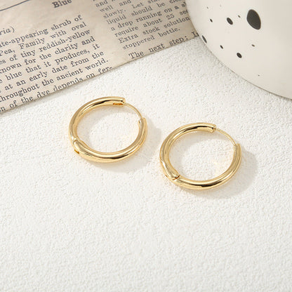 Women's hoop earrings with modern, textured design Tom Cottons