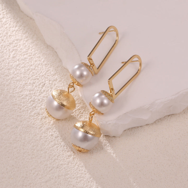 Ladies earrings with elegant pearl design Tom Cottons