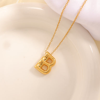 Women's necklace with curved letter pendant Tom Cottons