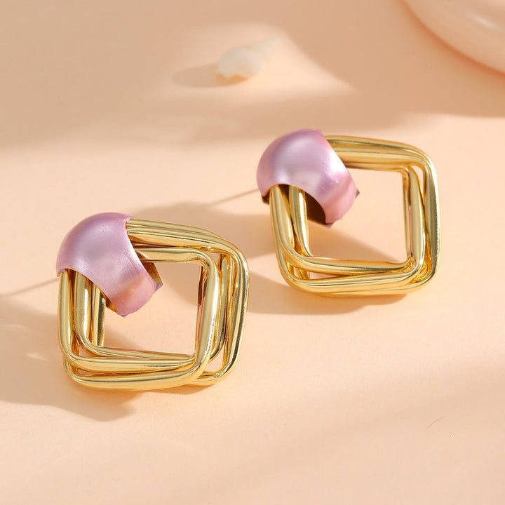 Women modern earrings with asymmetrical design Tom Cottons