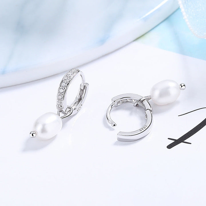 Ladies earrings with elegant zirconia decorations and pearl pendants Tom Cottons