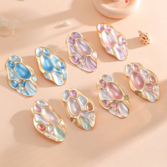 Ladies ear clips with elaborate, colorful shell design Tom Cottons