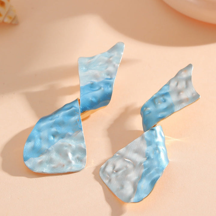 Ladies earrings in modern disc design Tom Cottons