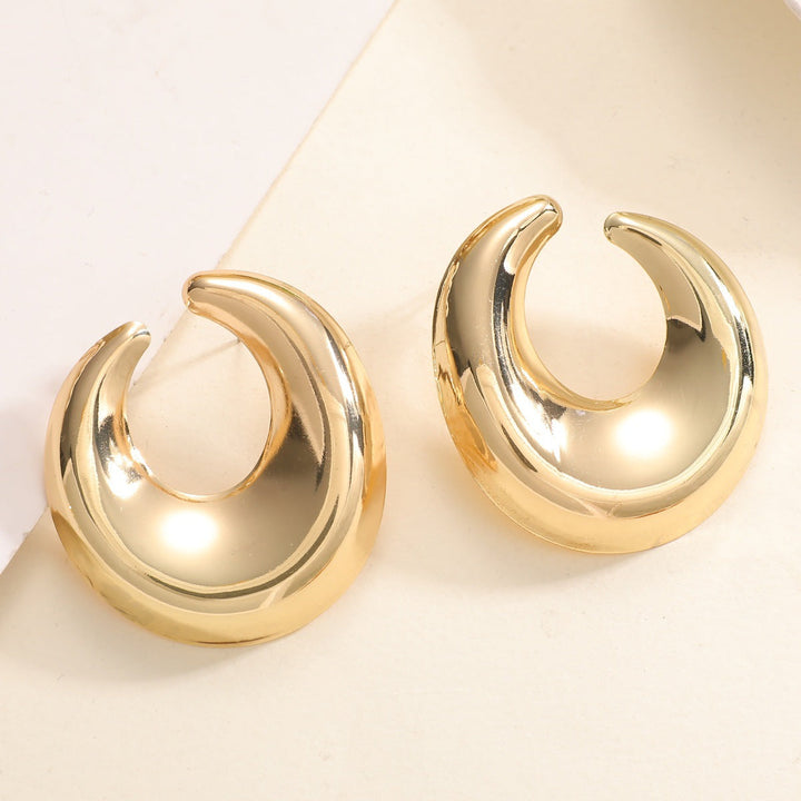 Women's earrings with elegant curved design Tom Cottons