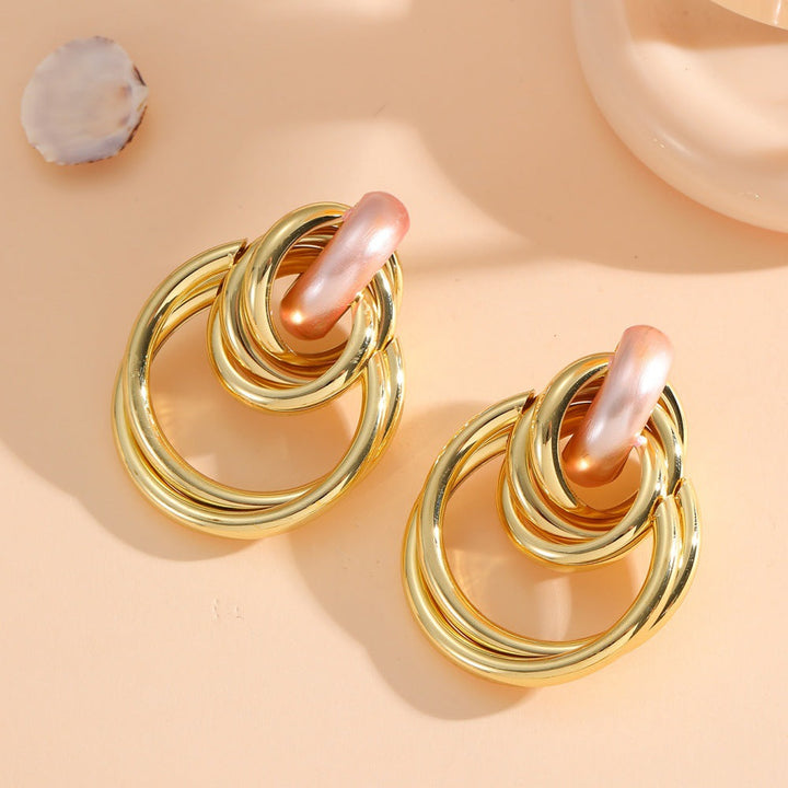 Women's Hanging Earrings with Elegant, Sculptural Design Tom Cottons