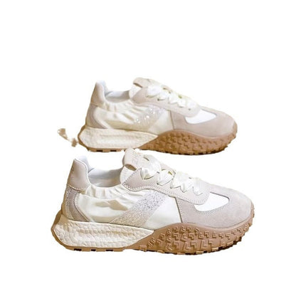 Women's sporty sneakers with sparkling accents and futuristic design