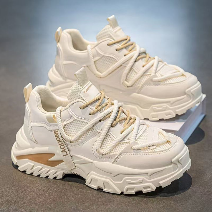 Women's sporty sneakers with a robust profile and breathable upper material