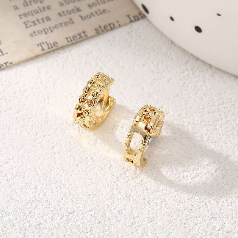 Women's hoop earrings with modern, textured design Tom Cottons