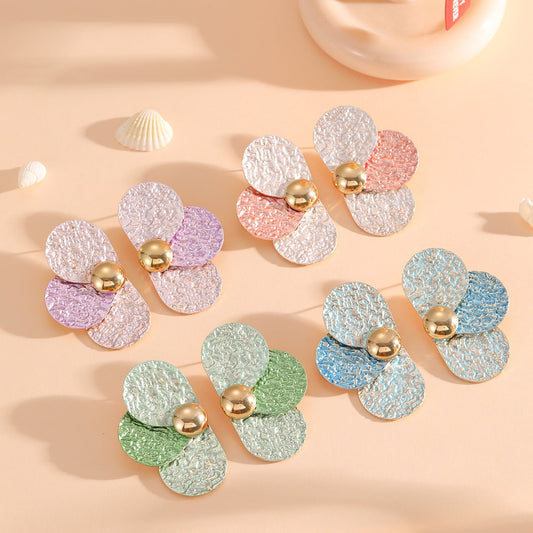 Women's ear clips in elaborate floral pattern Tom Cottons