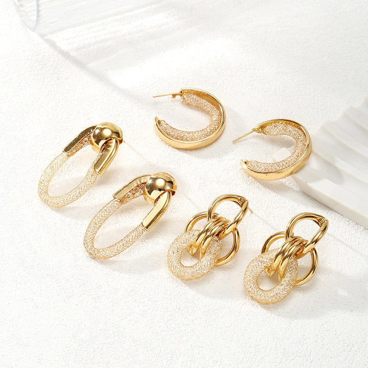 Ladies Hanging Earrings with Innovative, Gold-colored Design Tom Cottons
