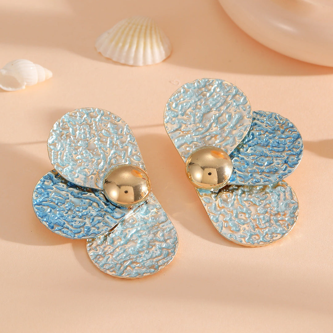 Women's ear clips in elaborate floral pattern Tom Cottons