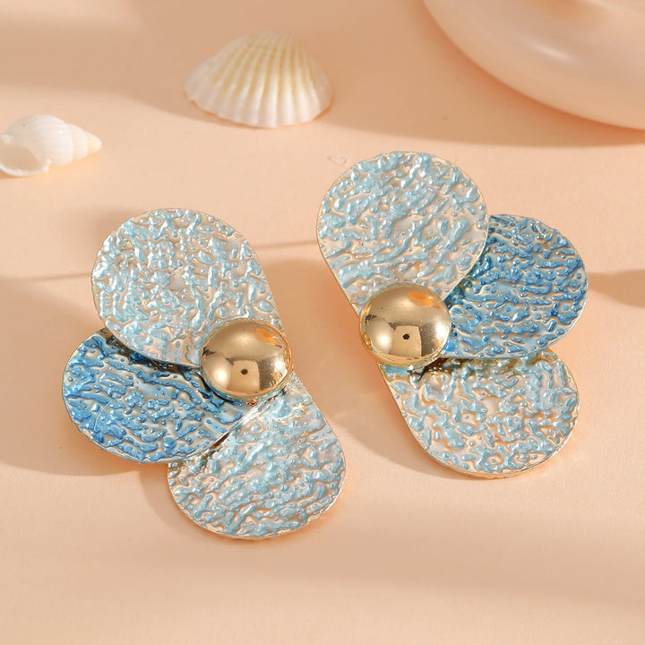 Women's ear clips in elaborate floral pattern Tom Cottons