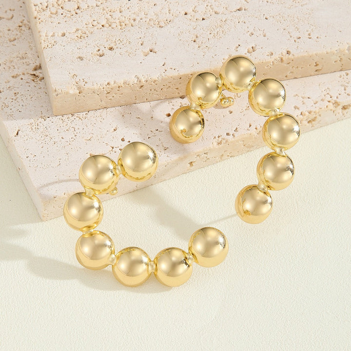 Women's bracelet with structured, golden beads Tom Cottons