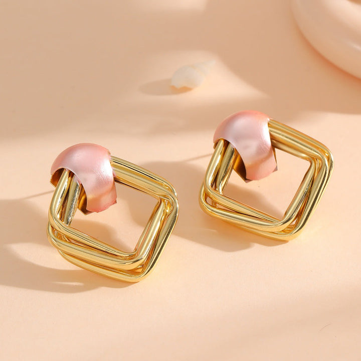 Women modern earrings with asymmetrical design Tom Cottons