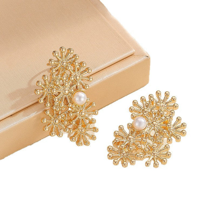 Women’s ear clips with elaborate flower design and pearl accent Tom Cottons