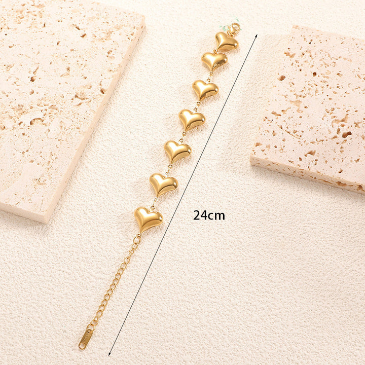 Ladies' bracelet with elegant heart design and fine link chain Tom Cottons