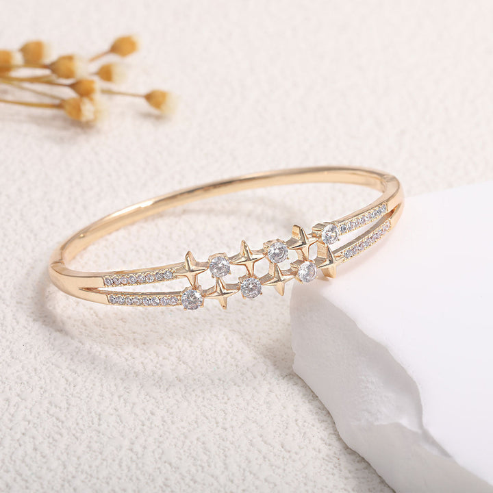 Women's bangle with elegant infinity pattern and sparkling zirconia Tom Cottons