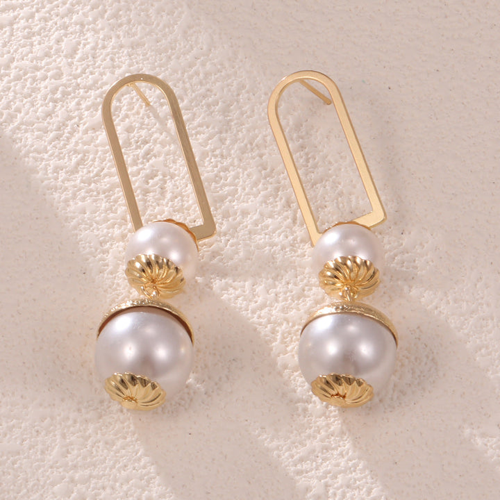 Ladies earrings with elegant pearl design Tom Cottons