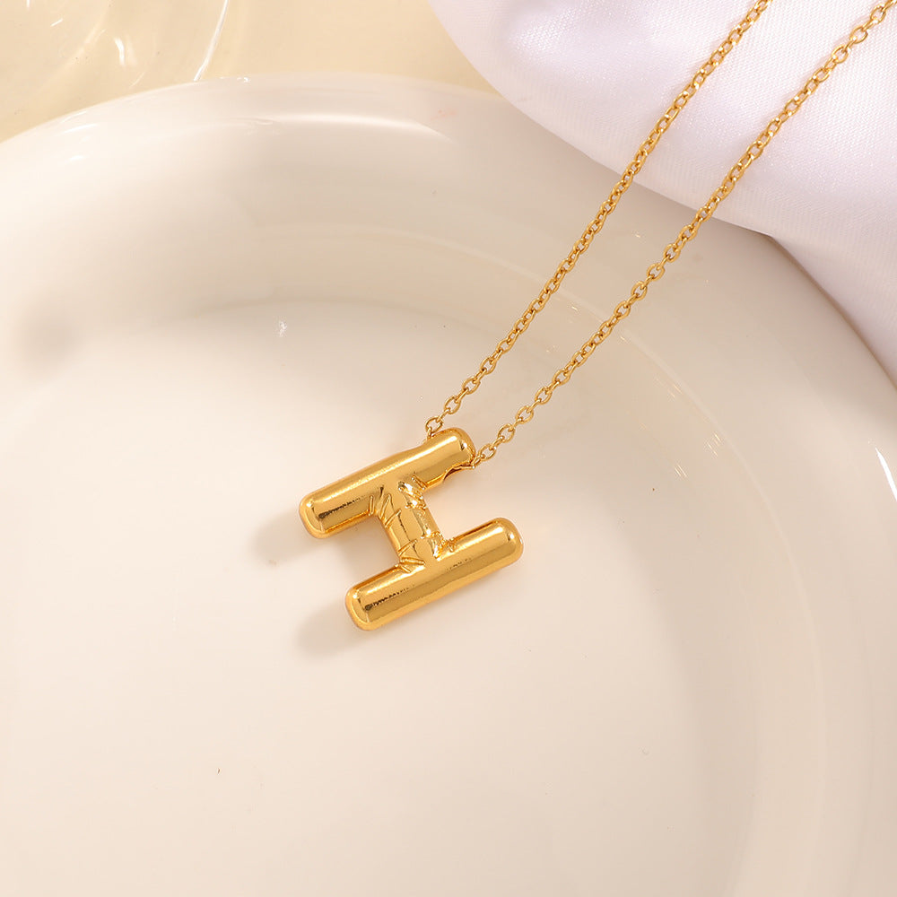 Women's necklace with curved letter pendant Tom Cottons