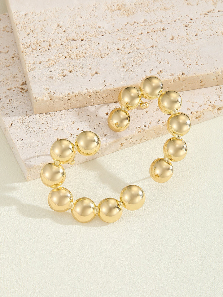 Women's bracelet with structured, golden beads Tom Cottons
