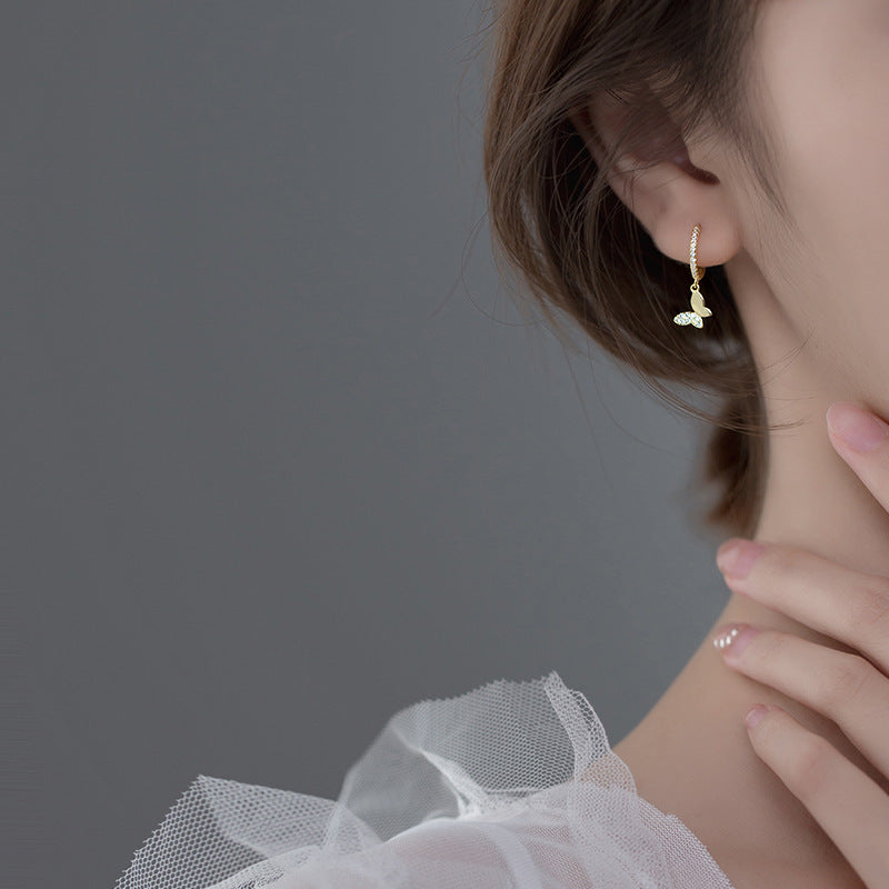 Ladies earrings with elegant butterfly design and sparkling details Tom Cottons