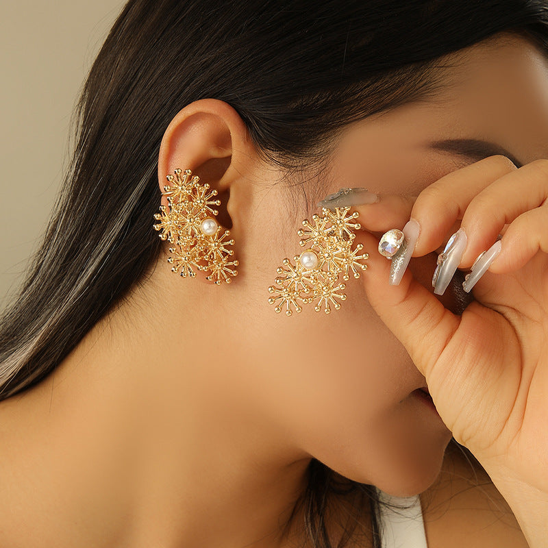 Women’s ear clips with elaborate flower design and pearl accent Tom Cottons