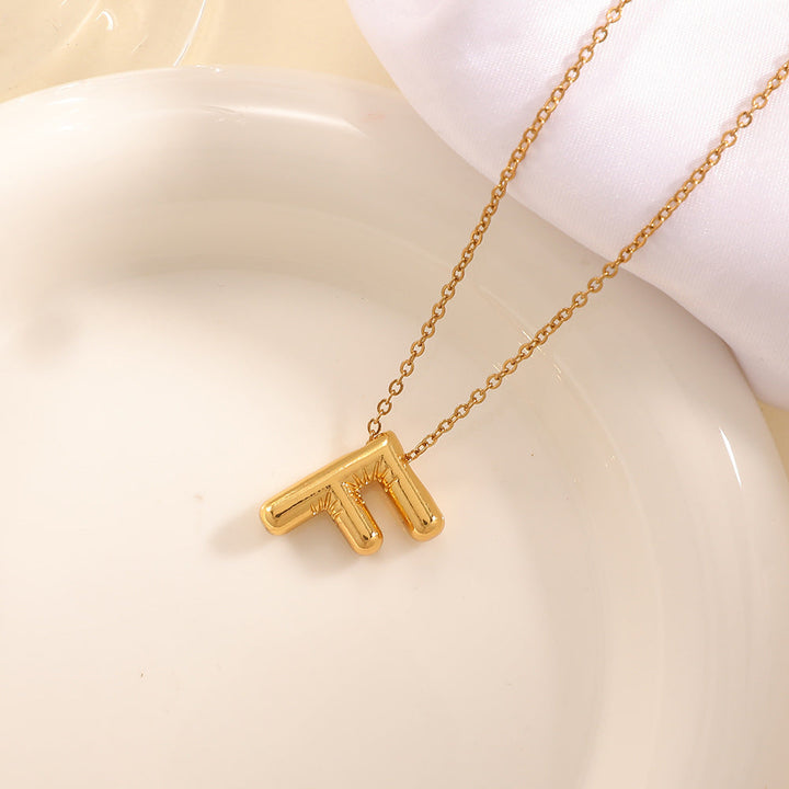 Women's necklace with curved letter pendant Tom Cottons