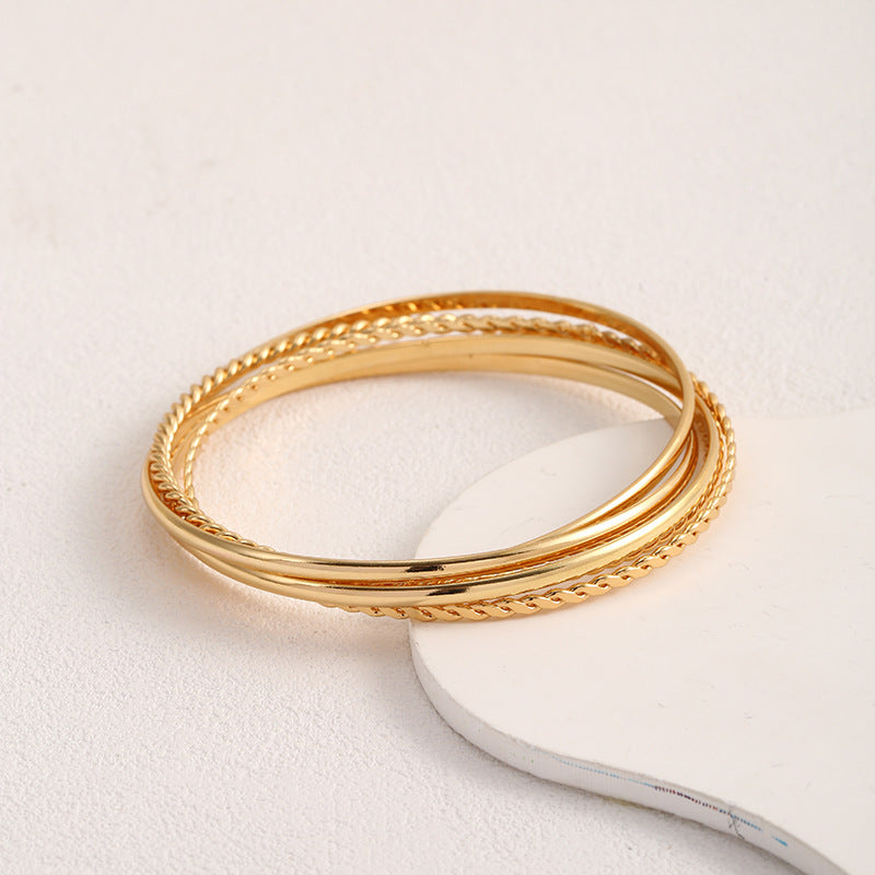 Women's bangle set with elaborate, braided and simple designs Tom Cottons