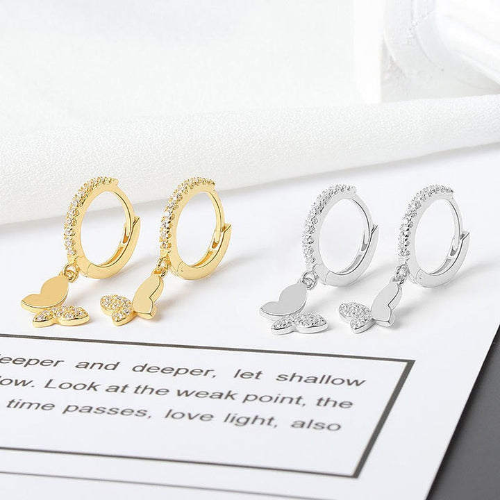 Ladies earrings with elegant butterfly design and sparkling details Tom Cottons