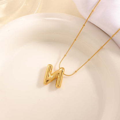 Women's necklace with curved letter pendant Tom Cottons