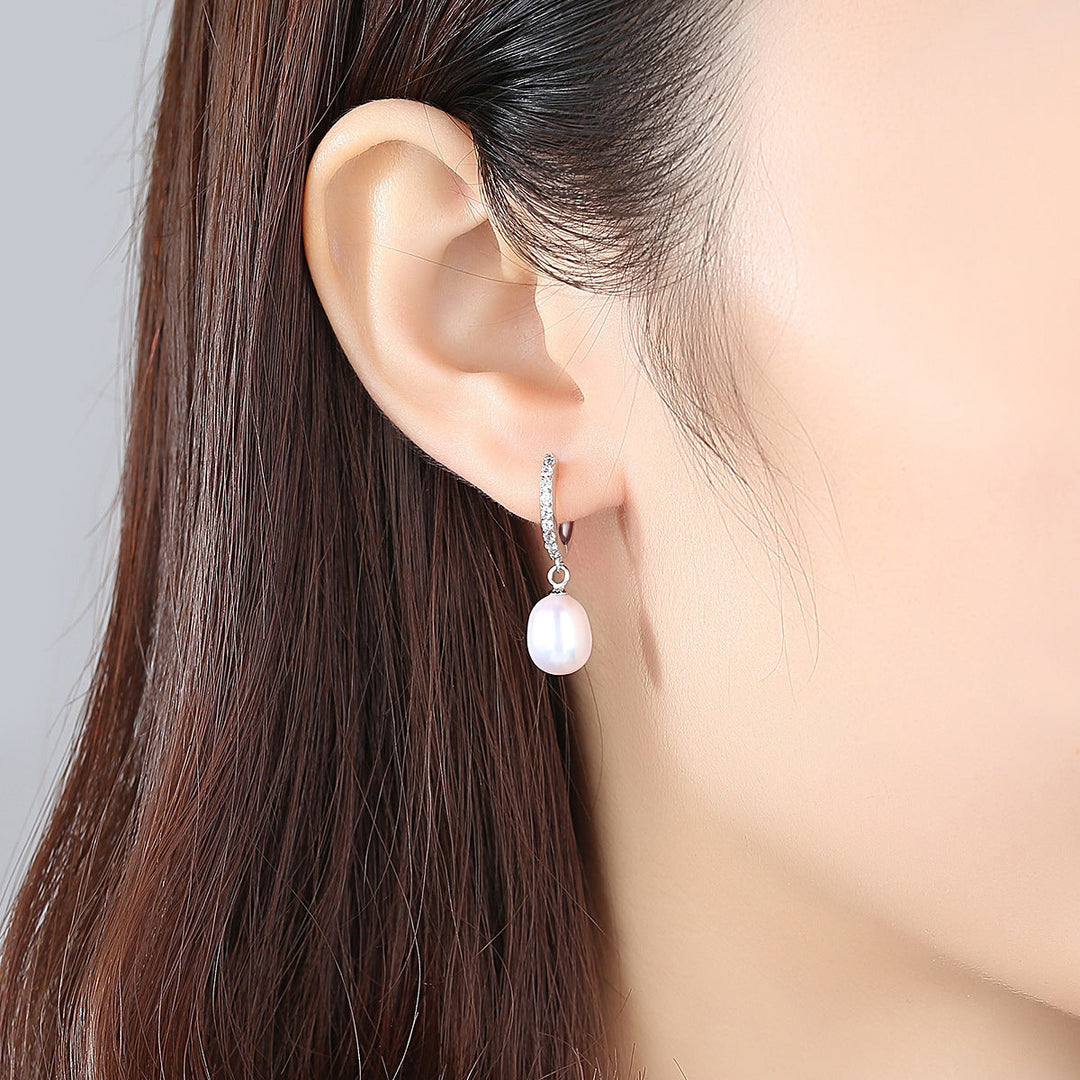 Ladies earrings with elegant zirconia decorations and pearl pendants Tom Cottons