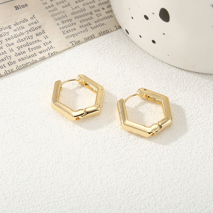 Women's hoop earrings with modern, textured design Tom Cottons